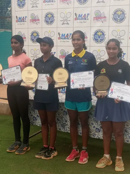 The girls' doubles finalists at the NS U-14 tournament, with our player Eshita on the right. Competing for titles is a regular occurrence for our dedicated athletes.