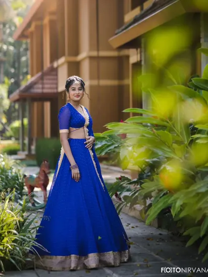 A simple yet elegant dotted georgette lehenga in a striking royal blue. The subtle gold border adds a touch of tradition to this otherwise modern and breezy outfit, perfect for a daytime event or a pre-wedding puja.