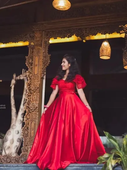 Looking like a princess in our red satin ballgown. The full skirt and simple, elegant design make it a timeless choice for any grand occasion.