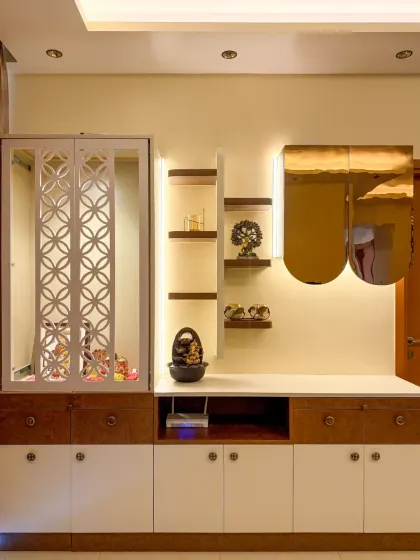 Here, our smart lighting highlights a modern puja unit and shelving, turning decorative items into beautifully lit features.