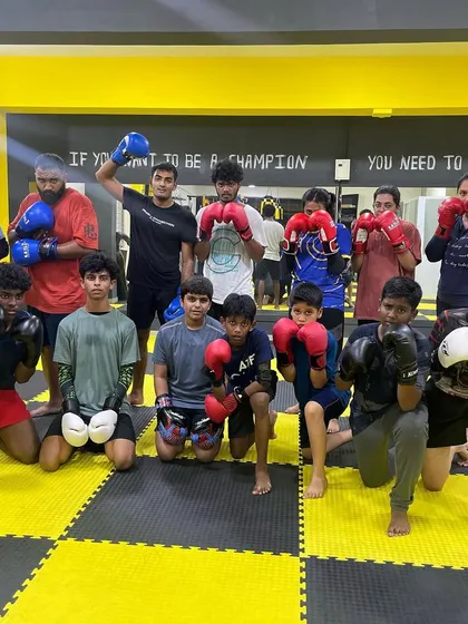 A powerful stance from our members after a demanding workout. Join us to learn MMA.