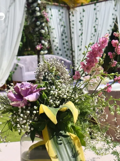 Another angle of the vibrant centerpiece, showing the variety of flowers used to create a lush, garden-fresh look.