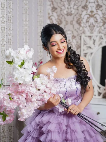 A lovely, joyful portrait in the purple ruffle gown, perfect for capturing a sweet and romantic moment.