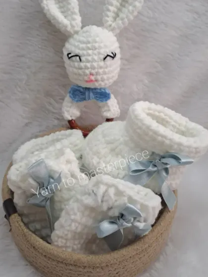 For a baby boy, I offer this hamper in classic white and baby blue. The soft booties and mittens are gentle on a newborn's skin.