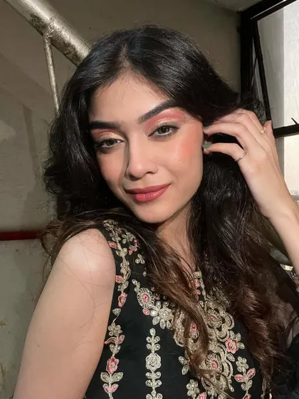 A final pose showing the complete makeup and hair for this party guest.