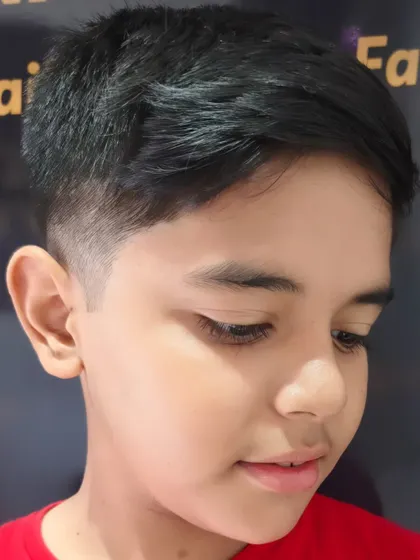 Bringing up the style game with a neat and tidy haircut for this young boy.