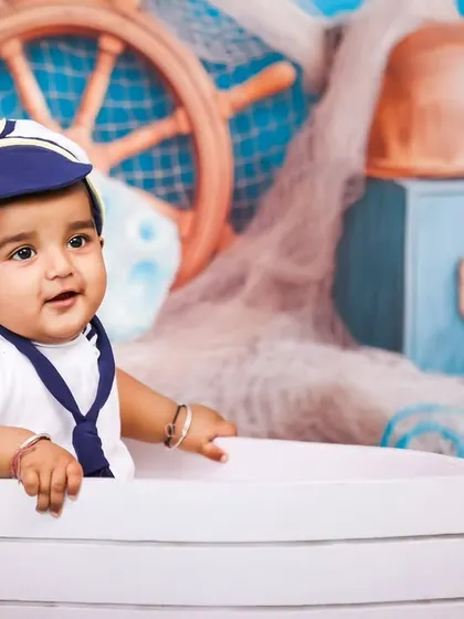 A close-up portrait of the little captain. I provide complete outfits, including this adorable sailor's hat, to perfect the look for any themed session.