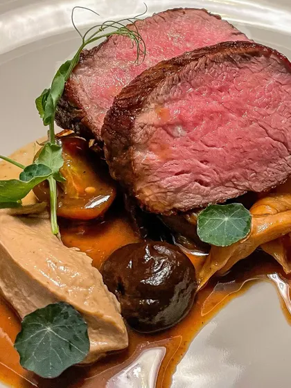A perfectly seared fillet steak, served with a rich port sauce, mushroom ketchup, and rehydrated tomatoes for a modern take on a classic.