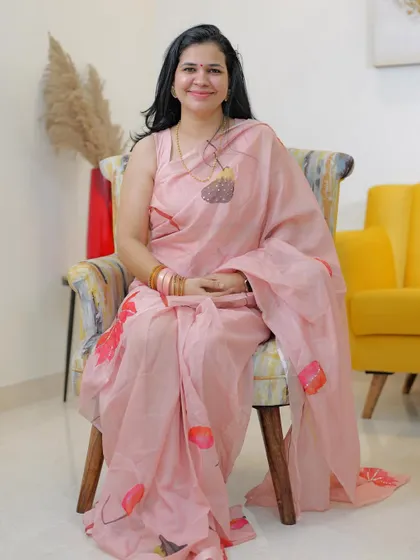 This lovely hand-painted pink organza saree is from Label L F. It's such a delicate and artistic piece, showcasing the unique talent of our homegrown designers.