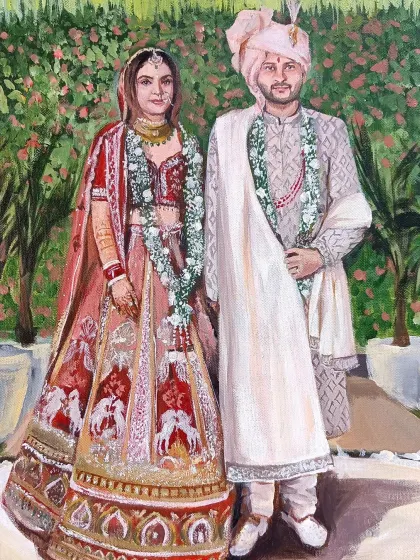 A detailed portrait of a couple from a live wedding painting in Delhi. The bride's pastel lehenga and the groom's coordinated sherwani are captured with care.