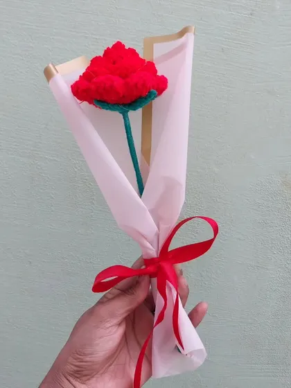 A single red rose bouquet, elegantly wrapped. A classic romantic gesture, handmade to last forever.