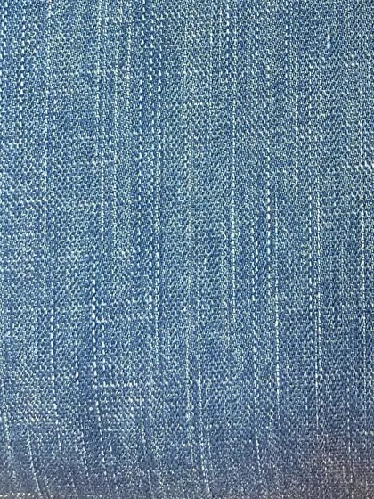 This light wash denim has a vertical slub texture, giving it a vintage, pre-worn look that adds character to any custom garment.