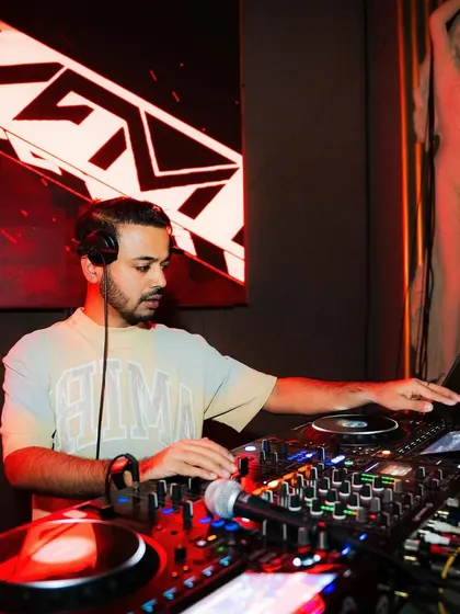 A calm moment at the decks, preparing for the next high-energy track.