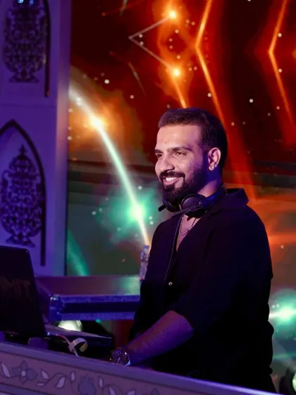 Let the music, lights, and drinks create that "aaj ki party meri taraf se" aura. A candid smile during a set.