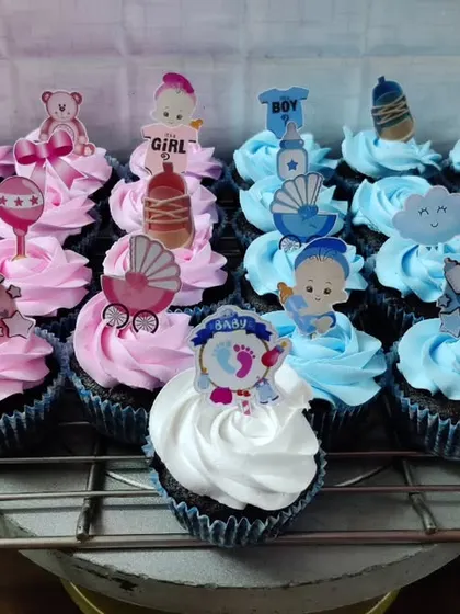 Celebrating a new arrival is so special, and these baby shower cupcakes are designed to match the excitement. This set includes both pink and blue frosted cupcakes with adorable themed toppers like baby clothes, strollers, and teddy bears.