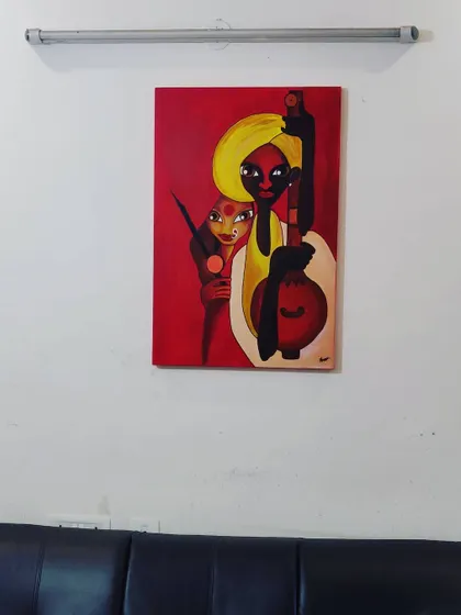The finished musician painting hanging on a client's wall. This shows the scale of the piece and how it can transform a simple wall into a gallery space.