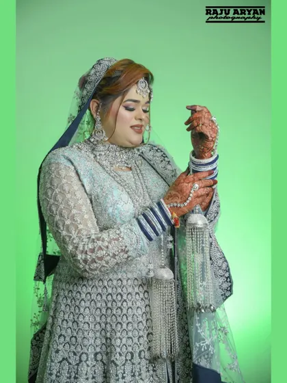 The bride admiring her 'kaleerein', a traditional and emotional part of the ceremony. This shot focuses on the cultural details and the bride's connection to them.