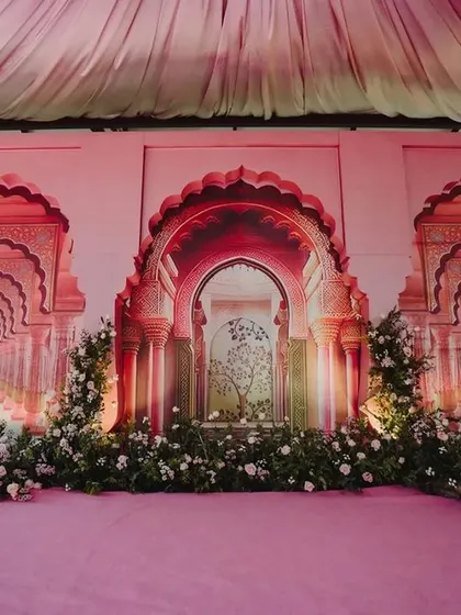 We brought the grandeur of Rajasthani palaces to this Sangeet stage. The backdrop features intricate arches inspired by Jaipur architecture, creating a royal and traditional setting for the pre-wedding celebration.
