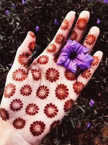 Even simple, modern designs like this repeating floral pattern result in a gorgeous, deep red stain thanks to the quality of my henna paste.