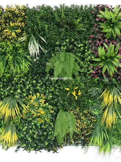 A close-up view of one of our custom vertical garden panels, showcasing a rich mix of artificial ferns, grasses, and colorful foliage to create a realistic, dense green wall.