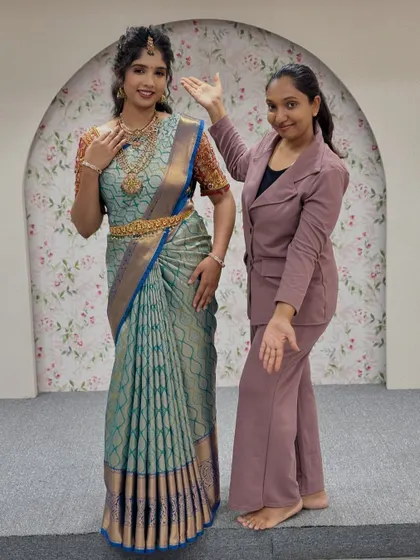 Presenting the final look. This image shows how a perfectly draped saree enhances the entire silhouette, creating a graceful and elegant profile.