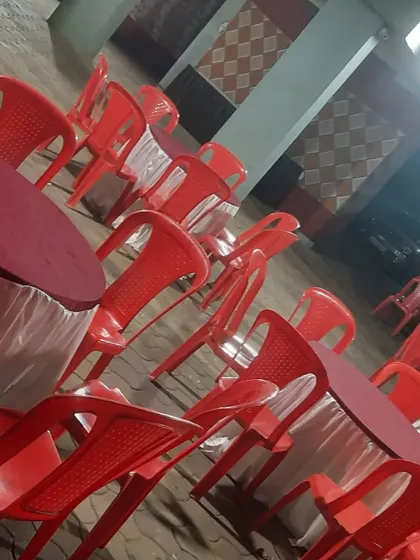 Round tables and chairs set up for guest seating. I ensure all furniture is clean and arranged properly.