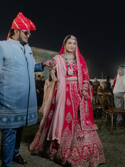 Bhavika's grand entrance. Her timeless bridal makeup ensures she looks stunning and feels confident during the most important moments of her wedding.