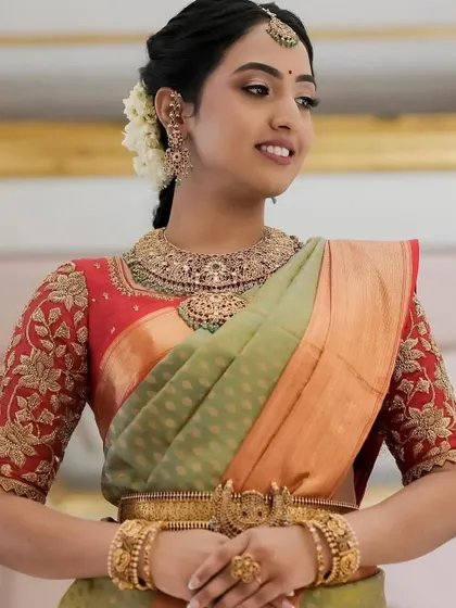 A close-up of the client's beautiful smile and her stunning ensemble. The custom-designed blouse is a true work of art.