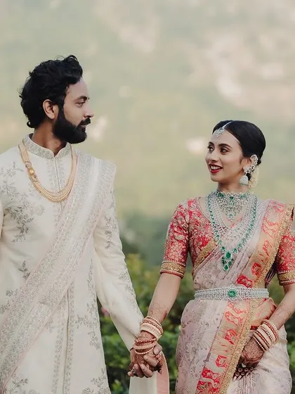 A beautiful couple portrait of Prathima and Smaran. Her makeup was designed to look flawless in the beautiful outdoor setting of Amitarasa, with its misty hills providing a stunning backdrop.