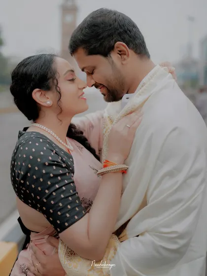 An intimate close-up of a couple in Mysore, their genuine smiles and embrace telling a story of love.