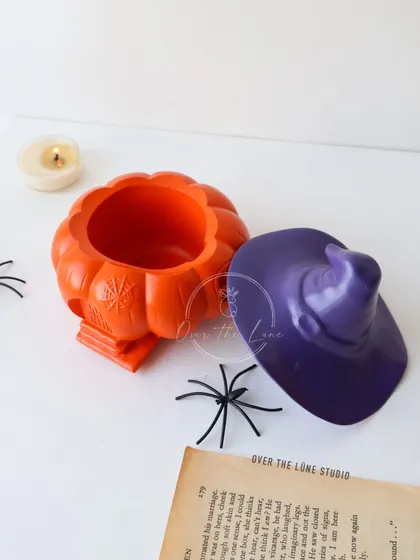 The Witch House Pumpkin Jar with its lid off, showing that it's a functional container for storing small trinkets.