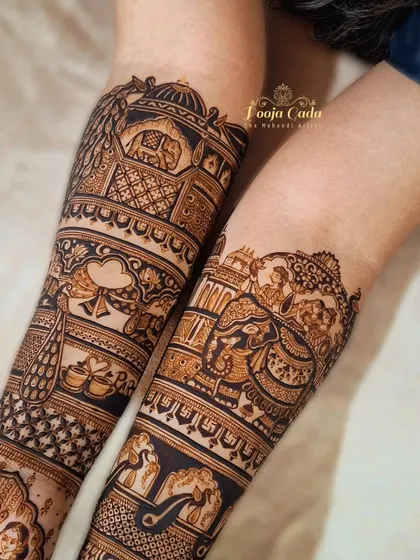 A close-up of a bridal start-up, showing the intricate details of elephant and peacock motifs.