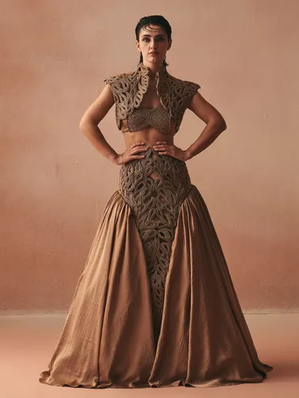 This ensemble features a full-volume skirt and a matching cropped jacket, both defined by intricate cordwork. The centerpiece is the structured bralette, showcasing how I use corsetry to build a powerful, layered look.