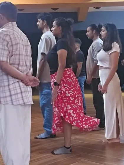Students in a line practicing their posture during a free introductory workshop. We focus on getting this right from the beginning as it is the foundation for everything else in Tango.