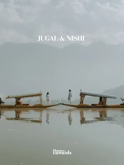 Two shikaras meet on the calm waters of Dal Lake. This pre-wedding shoot in Kashmir was about capturing serenity and connection, using the iconic landscape to mirror the couple's peaceful and profound love.