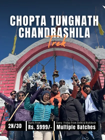 The entrance to the Tungnath trek covered in snow, with our excited group ready for the adventure. This trip is perfect for both beginners and experienced trekkers looking for a memorable winter experience.