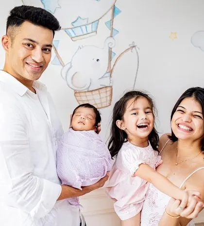 A beautiful family of four celebrating their newest member. I love capturing these moments against the backdrop of your baby's own nursery.