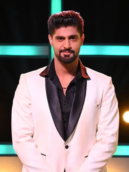 A closer look at the sharp tailoring of the white tuxedo jacket worn by Tanuj Virmani.