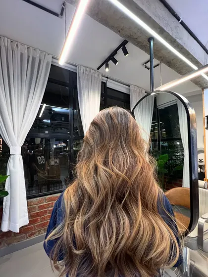 A closer look at the brunette balayage, where you can see the delicate hand-painting technique that creates such a natural, sun-kissed effect.