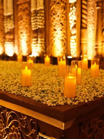 A detail shot of the bar area, where even the smallest elements were designed to match the theme, with carved panels and beds of fresh baby's breath.