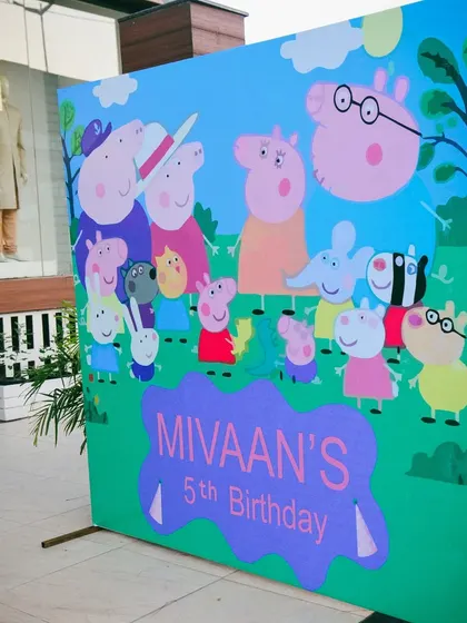 A large, vibrant photo backdrop for the Peppa Pig party, perfect for capturing memories with all the favorite characters.