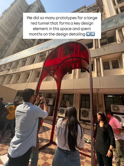 Behind the scenes of our team inspecting the prototype for the red entrance tunnel in our office parking lot. Every big idea starts with detailed planning and testing.