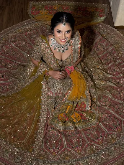 Another beautiful aerial shot of the lehenga, showing the intricate details and the way the dupatta adds a pop of contrasting color.