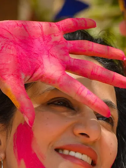 A playful moment during a Holi celebration. I encourage interaction and fun, making the dance party a truly social and engaging experience.