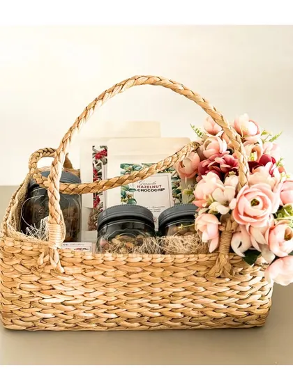 What’s the perfect way to say “Thank you”? We think this luxurious seagrass basket, overflowing with delicious treats and a beautiful floral arrangement, is a great start.