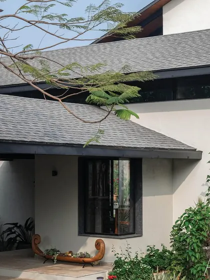 The entrance of Grove House, featuring a unique boat-shaped bench, a nod to the owner's love for sailing.