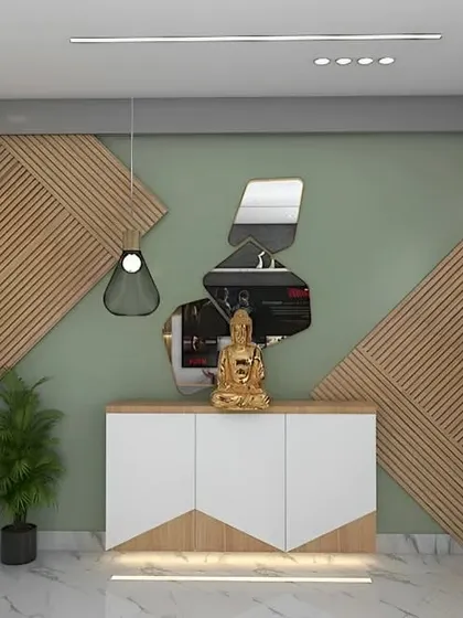 An abstract and modern entryway design. The console features a mix of wood and white, set against a green accent wall with geometric wood paneling and uniquely shaped mirrors.