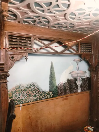 The work-in-progress of the Mughal garden scene, complete with a fountain and lush greenery. This custom wall art was designed to create a unique, fine-dining experience.