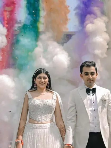 A colorful smoke bomb entry that adds a huge wow factor to the couple's celebration.