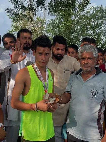 Celebrating a young athlete's victory at a local run. Seeing the joy and pride in their eyes is my biggest reward.